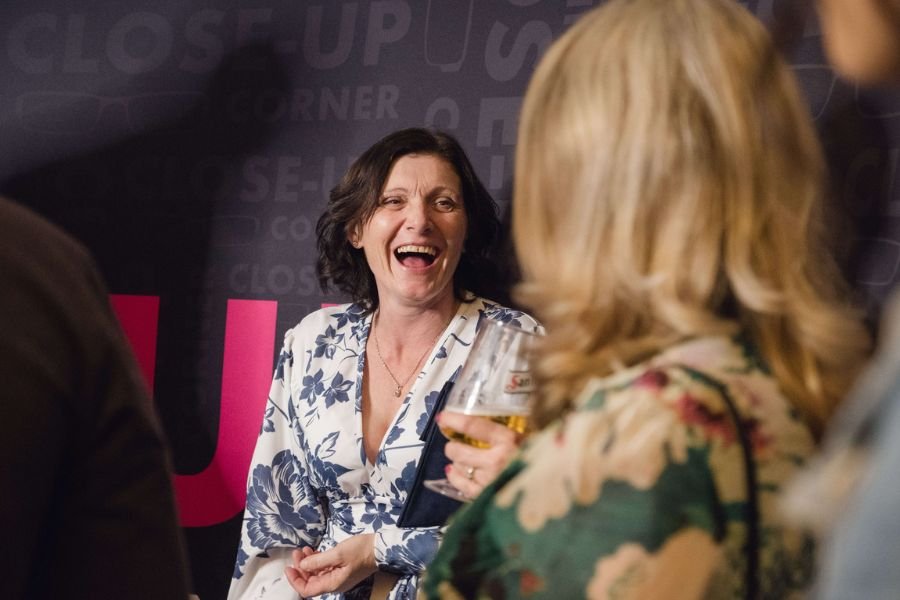 Guests laughing and reacting to close-up magic at The Close-Up Corner