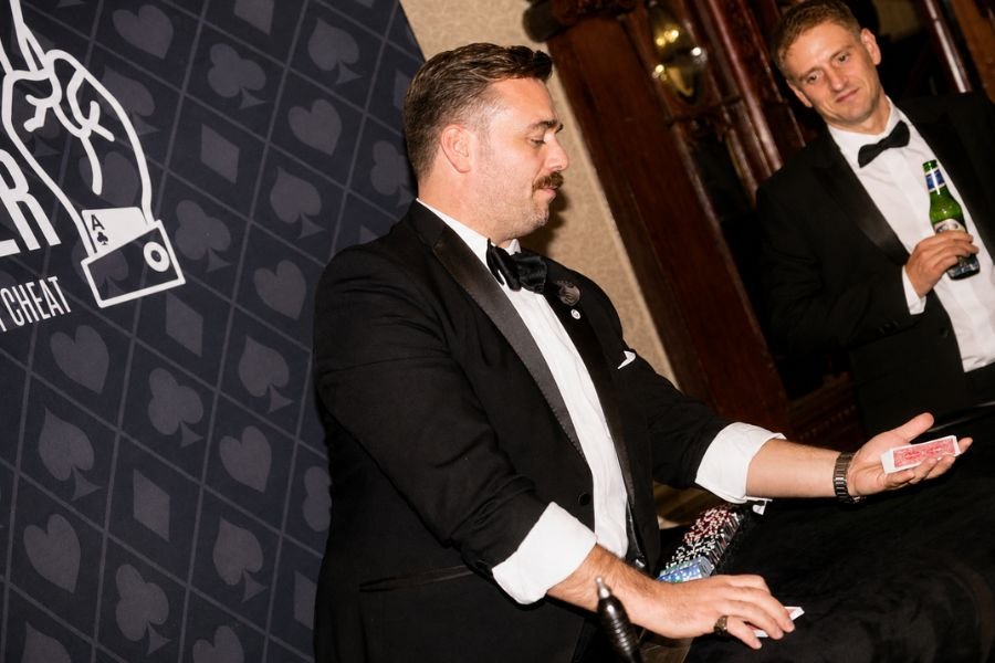 A casino magician entertaining a corporate crowd