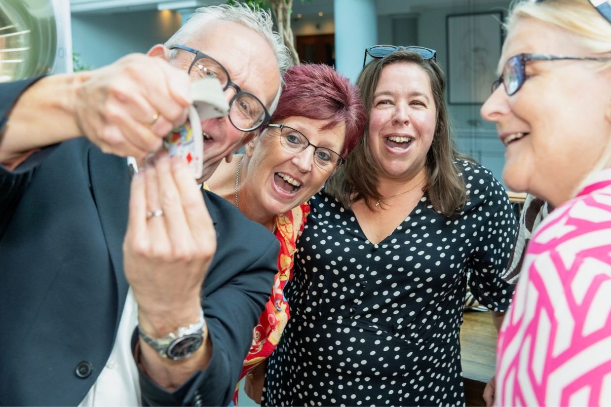 Corporate guests reacting to a close-up magician