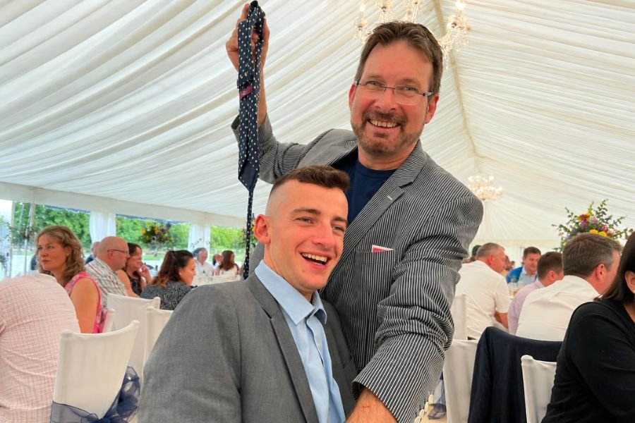 A pickpocket magician entertaining a corporate crowd