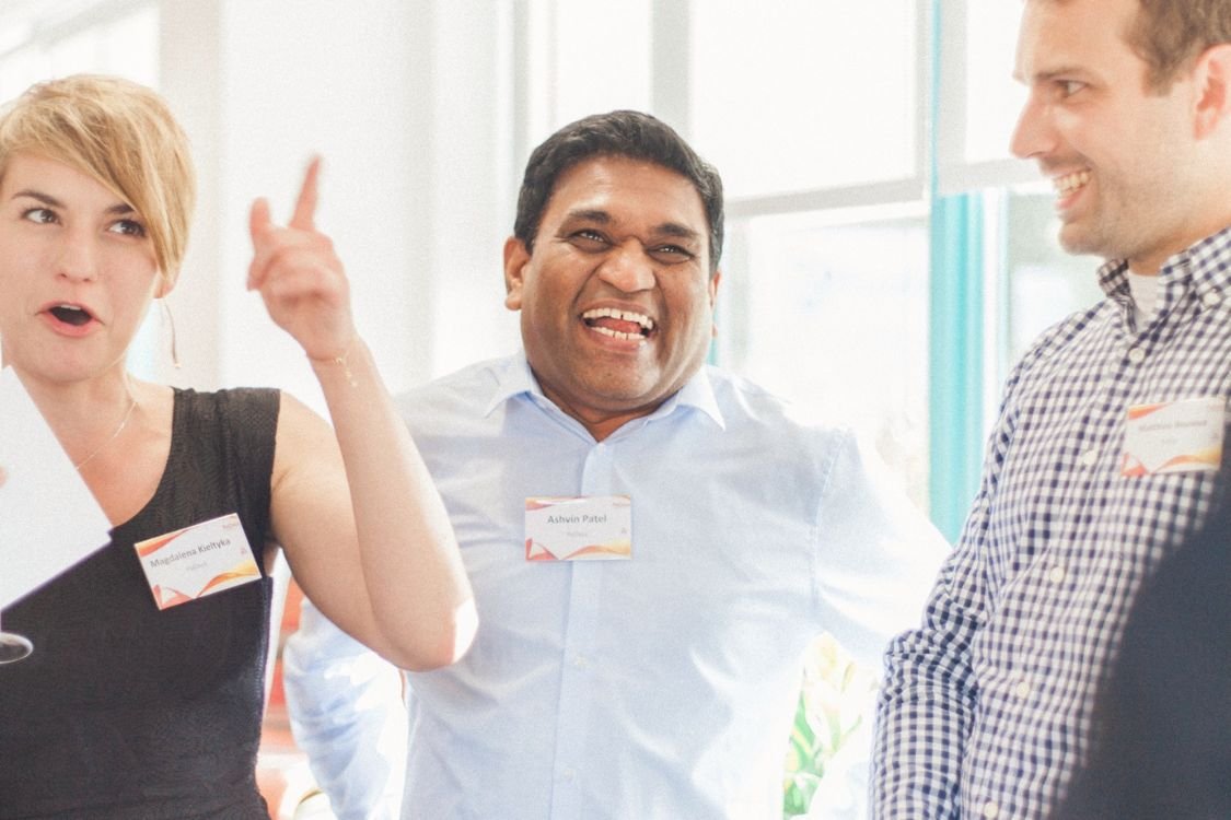Colleagues reacting to a magic trick during a team building day
