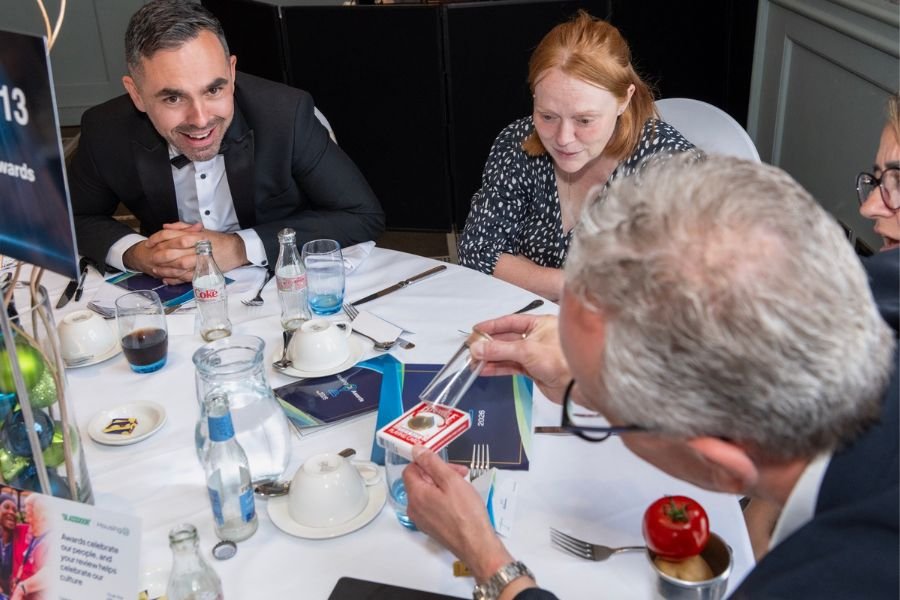 Guests reacting at a drinks reception