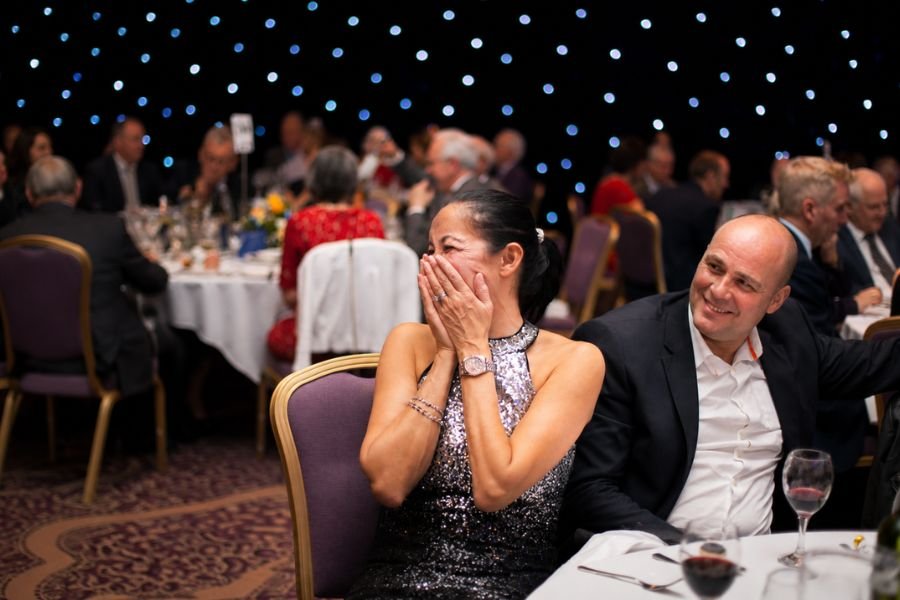 A stunned reaction at a corporate event