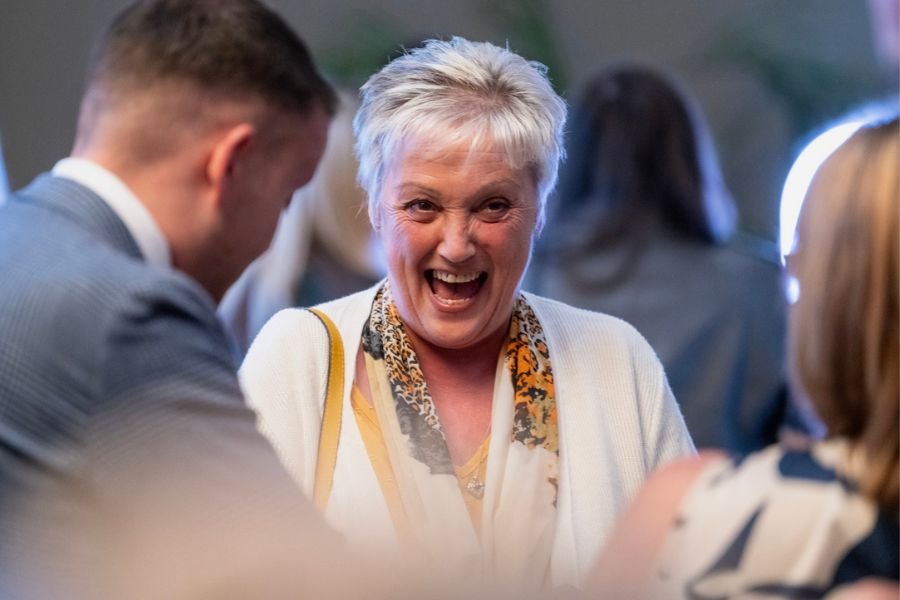 A corporate crowd enjoying magic